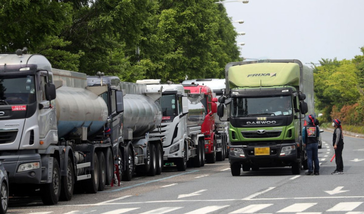 Members of the Cargo Truckers Solidarity union stop a truck during a strike in Yeosu, South Korea, June 9, 2022.   Yonhap via REUTERS   