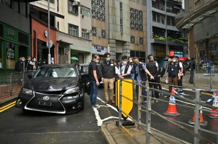 Hong Kong media reported an overnight clash that left one man with a gunshot wound and two others injured