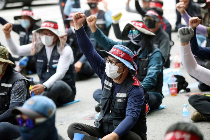 Members of the Cargo Truckers Solidarity union take part in a protest in front of Kia Motor's factory tin Gwangju, South Korea, June 10, 2022. Yonhap via REUTERS