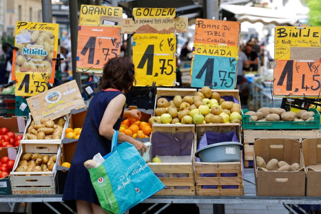 Price tags are seen as a woman shops at a local market in Nice, France, June 7, 2022.    