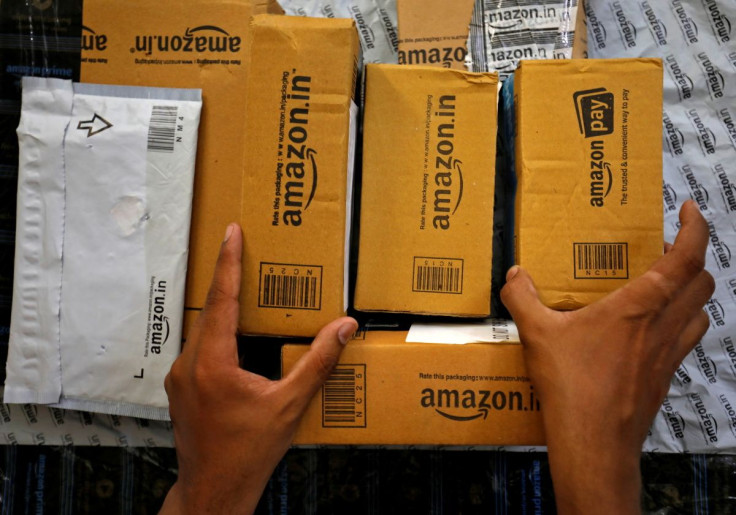 A worker sorts delivery packages in a van outside an Amazon facility in Ahmedabad, India, March 17, 2021. Picture taken March 17, 2021.