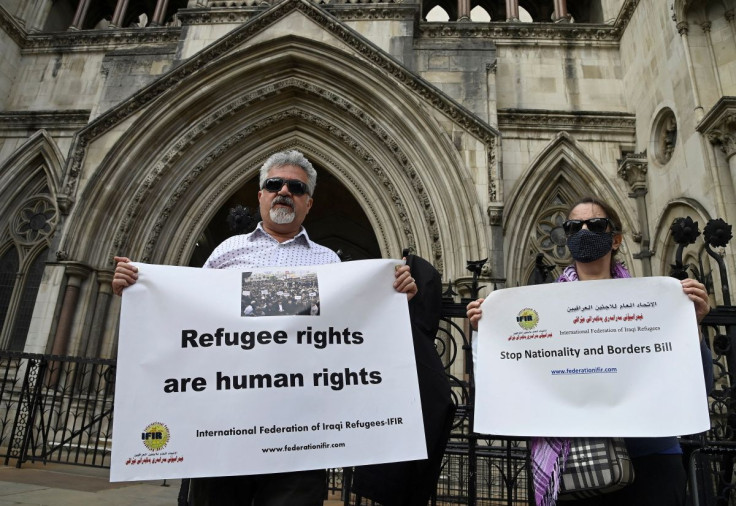 Demonstrators protest outside the Royal Courts of Justice whilst a legal case is heard over halting a planned deportation of asylum seekers from Britain to Rwanda, London, Britain, June 10, 2022. 