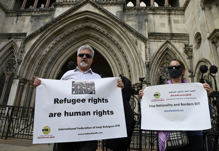 Demonstrators protest outside the Royal Courts of Justice whilst a legal case is heard over halting a planned deportation of asylum seekers from Britain to Rwanda, London, Britain, June 10, 2022.