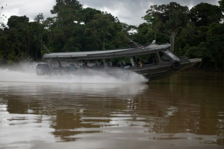A search boat looks for signs of British journalist Dom Phillips and Brazilian indigenous expert Bruno Pereira on the Itaguai river