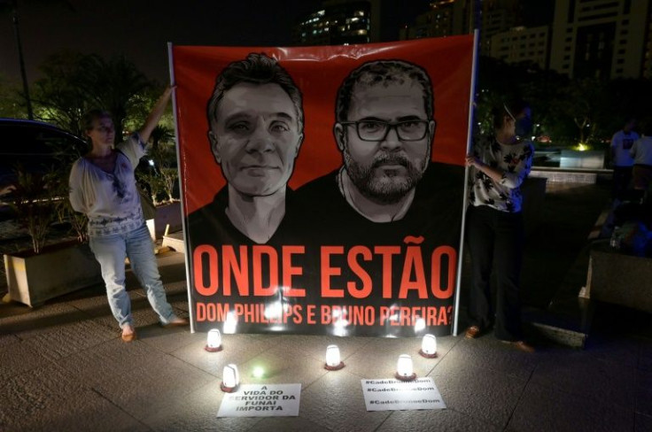 Demonstrators from the National Indigenous Foundation highlight the disappearance of British journalist Dom Phillips and Brazilian Indigenous affairs specialist Bruno Pereira, in Brasilia on June 9, 2022