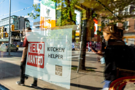 A help wanted sign hangs in a bar window along Queen Street West in Toronto Ontario, Canada June 10, 2022. 