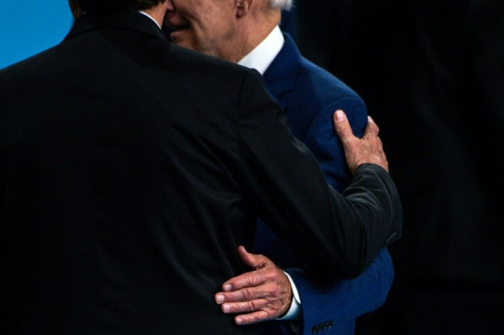 Brazil's President Jair Bolsonaro and US President Joe Biden chat following a family photo during the Summit of the Americas in Los Angeles on June 10, 2022