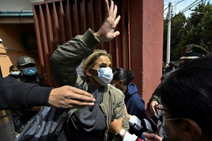 Jeanine Ãñez is escorted into prison in March of 2021 after being arrested over accusations she took part in a coup