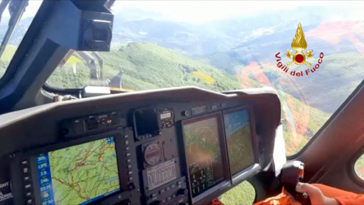 Fire brigade perform a search operation for a helicopter that vanished on Thursday with seven people aboard, including four Turkish businessmen, on the Apennines, Italy, June 10, 2022. Vigili del Fuoco/Handout via REUTERS