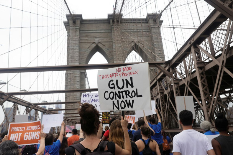 People cross the Brooklyn Bridge during "March for Our Lives" rally, one of a series of nationwide protests against gun violence, in Brooklyn, New York City, U.S., June 11, 2022. 