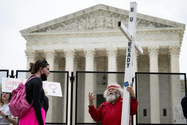 An abortion rights advocate and opponent outside the US Supreme Court
