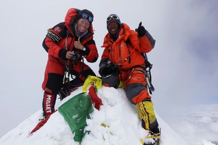 Norwegian mountaineer Kristin Harila (L), seen here at the summit of Mount Makalu, is on track to beat the time record for summiting the world's 14 highest peaks