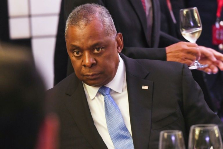 US Defense Secretary Lloyd Austin listens to China's Defence Minister Wei Fenghe at the ministerial roundtable luncheon at the Shangri-La Dialogue summit on Saturday