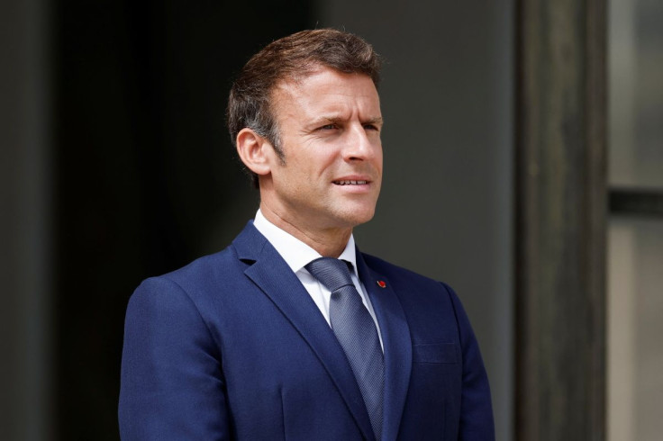 French President Emmanuel Macron welcomes a guest at the Elysee Palace in Paris, France, June 10, 2022.