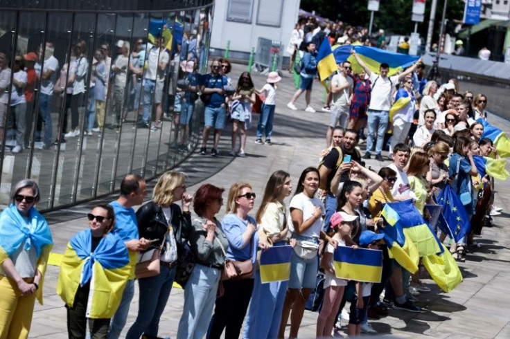 In Brussels, demonstrators brandishing blue and yellow Ukraine flags circled the European Commission headquarters in a show of support