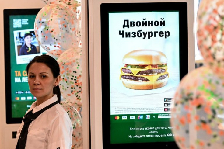 A restaurant that launched Mcdonald's in Russia in 1990, heralding Moscow's opening up after decades of Soviet rule, reopened Sunday with a new name and logo