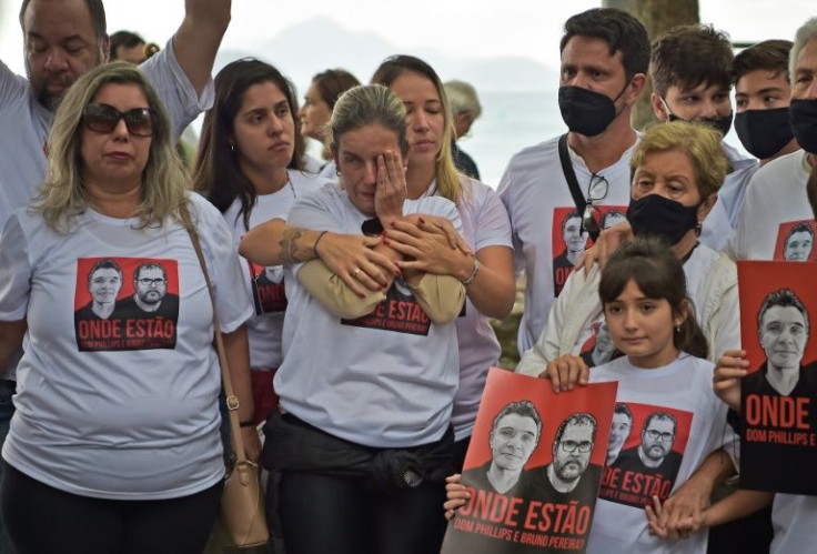 Fiends and relatives of British missing journalist Dom Philipps and Brazilian indigenous expert Bruno Pereira hold a vigil on Copacabana beach, in Brazil's Rio de Janeiro, but hopes of finding the two men alive were fading