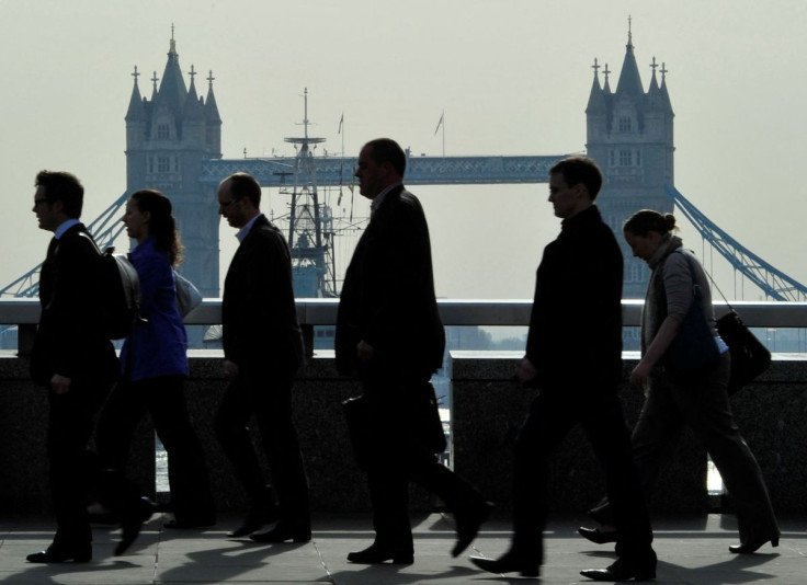 City workers cross London Bridge during the morning rush hour in London, April 11, 2011.