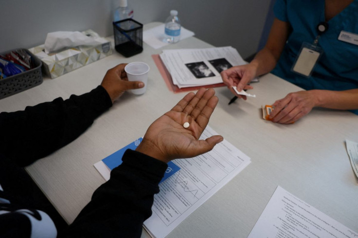 Dr. Shelly Tien, 40, gives a patient medication to start a medical abortion at Planned Parenthood in Birmingham, Alabama, U.S., March 14, 2022. 