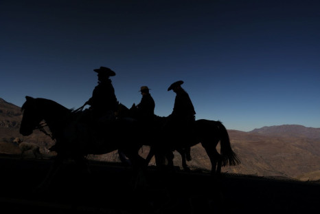 Cattle ranchers ride horses at Farellones, close to the Andes mountain range, in Santiago, Chile April 18, 2022. 