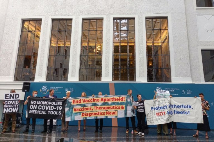 Non-governmental organisations staged a protest in the WTO's central atrium, chanting slogans and unfurling banners reading: "No monopolies on Covid-19 medical tools" and "End vaccine apartheid"