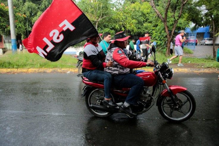 Supporters of Nicaraguan President Daniel Ortega take part in a march in Managua
