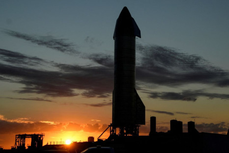 The sun sets as SpaceX prepares their super heavy-lift Starship SN8 rocket  for a test launch this week at the company's facilities in Boca Chica, Texas, U.S. December 1, 2020.  