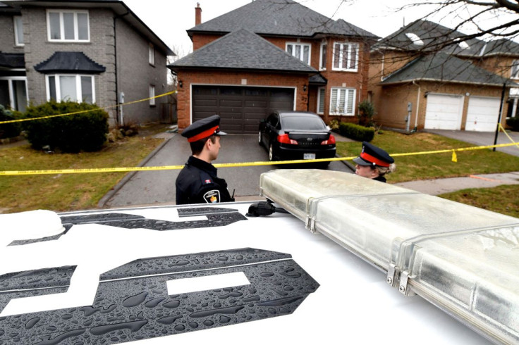 Police officers wait for a search warrant in front of the home of Alek Minassian, in Richmond Hill, Ontario, Canada, April 25, 2018.
