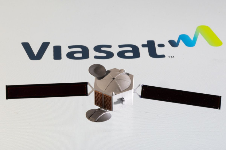 Satellite model is placed on Viasat logo in this picture illustration taken April 4, 2022. 