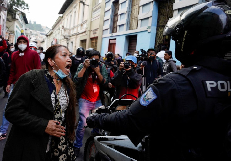 A woman argues with riot policemen, as Indigenous people protest against Ecuador's President Guillermo Lasso's economic and environmental policies, in Quito, Ecuador, June 13, 2022.