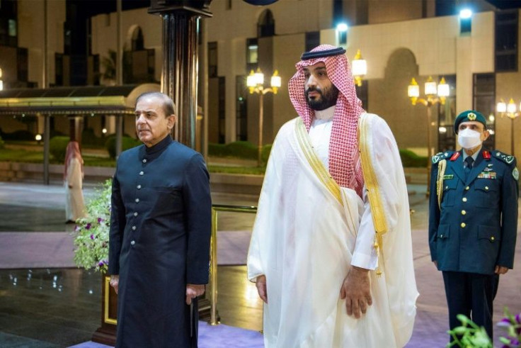 During his trip to Saudi Arabia, President Joe Biden is expected to meet with the oil-rich nation's crown prince and de-facto leader Mohammed bin Salman (R) -- seen in this handout image from the Saudi Royal Palace welcoming Pakistan's prime minister in A