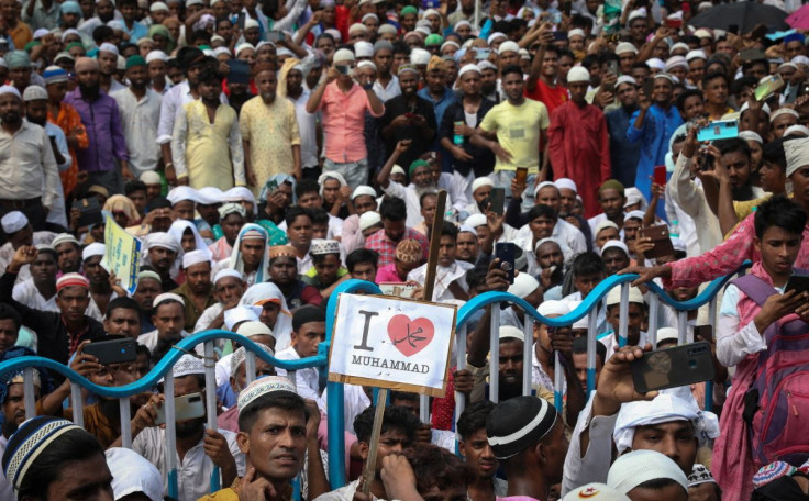 Muslims listen to a speaker during a protest demanding the arrest of Bharatiya Janata Party (BJP) member Nupur Sharma for her comments on Prophet Mohammed, in Kolkata, India, June 14, 2022. 