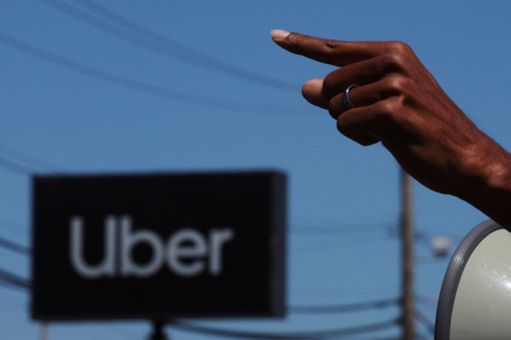 App driver Ehab Hilali speaks during a protest against Uber's elimination of fuel surcharges for drivers amid high gas prices, in Saugus, Massachusetts, U.S., June 14, 2022. 