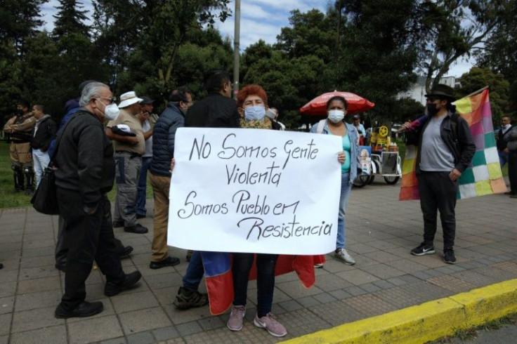 Demonstrators gathered outside the building where Leonidas Iza, leader of the powerful Confederation of Indigenous Nationalities of Ecuador (Conaie), was being held, holding signs including: "We are not violent people, we are people in resistance"