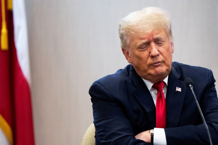 Former U.S. President Donald Trump listens as he attends a border security briefing with Texas Governor Greg Abbott to discuss security at the U.S. southern border with Mexico in Weslaco, Texas, U.S. June 30, 2021. Brandon Bell/Pool via REUTERS     