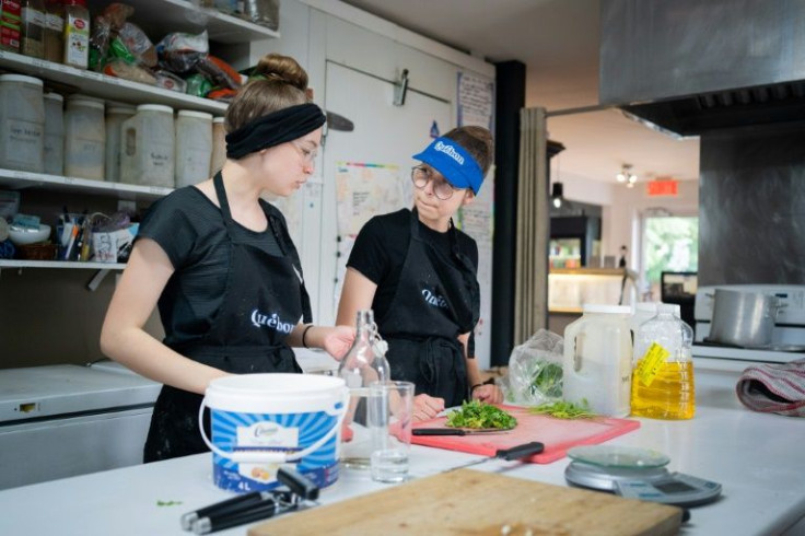 Sofia-Rose Adams, 13, and her sister Orlane, 17, work at a cafe and ice cream parlor in Saint-Mathias-sur-Richelieu, Canada