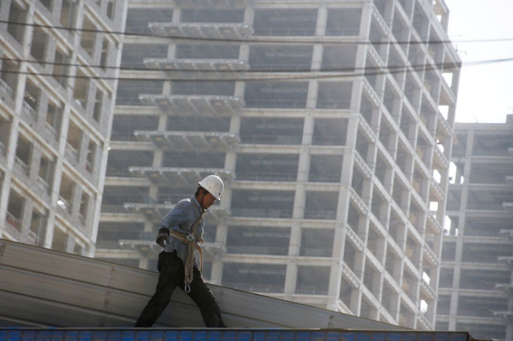 A man works at the construction site of a new financial district in Beijing, China May 23, 2017.