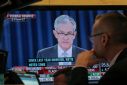 A trader watches U.S. Federal Reserve Chairman Jerome Powell on a screen during a news conference following the two-day Federal Open Market Committee (FOMC) policy meeting, on the floor at the New York Stock Exchange (NYSE) in New York, U.S., March 20, 20