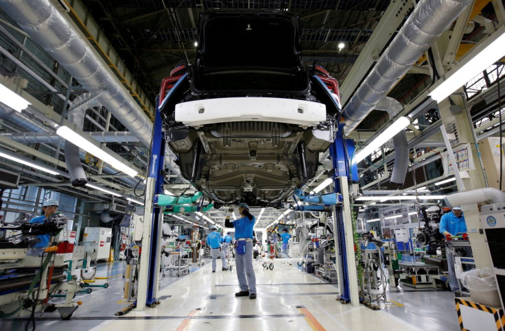 Employees of Toyota Motor Corp. work on an assembly line at the company's Motomachi plant in Toyota, Aichi prefecture, Japan May 17, 2018. Picture taken May 17, 2018.