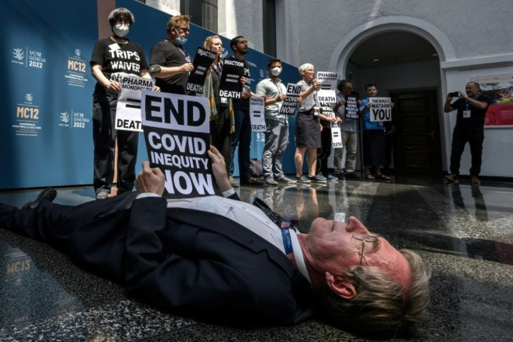 Civil society activists staged a "die-in" protest in the WTO's atrium, accusing the EU, Britain, Switzerland and the United States of scuppering a meaningful Covid intellectual property waiver