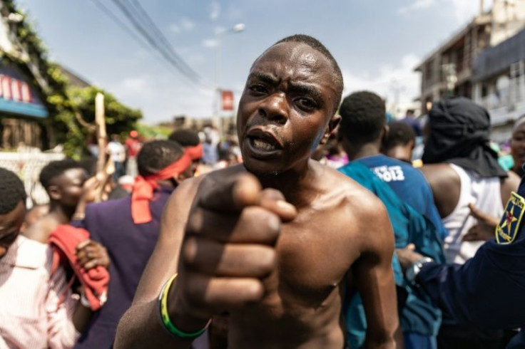 Demonstrators, some stripped to the waist, rushed the border with Rwanda