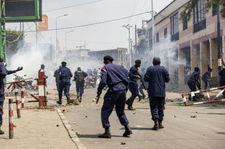 Riot police fired teargas to disperse the crowd