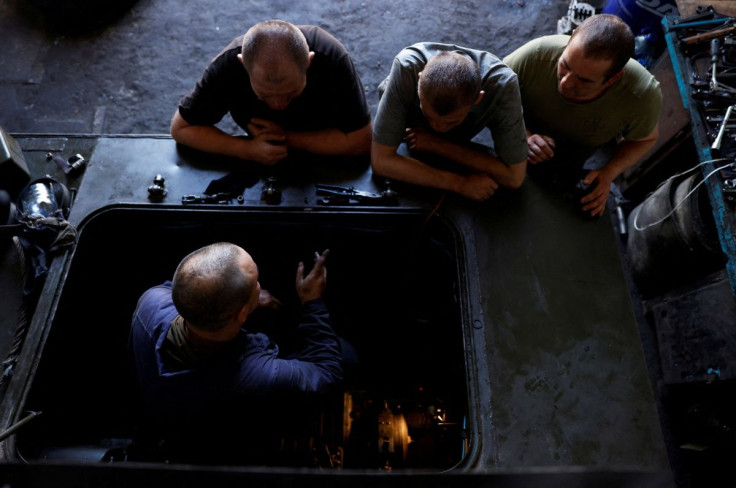 Mechanics repair a Ukrainian tank at a workshop, as Russia's attack on Ukraine continues, in Mykolaiv region, Ukraine June 12, 2022.