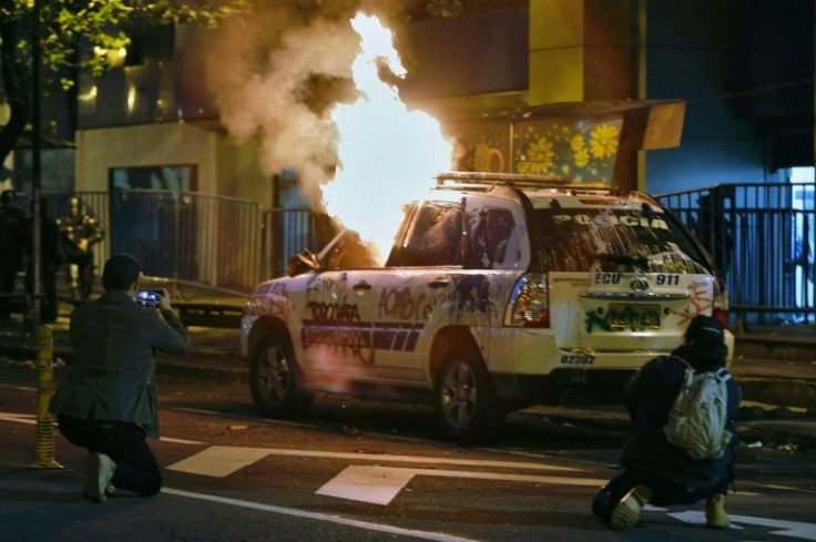 Protesters attacked Ecuador police vehicles in the capital Quito after the arrest of Indigenous leader Leonidas Iza