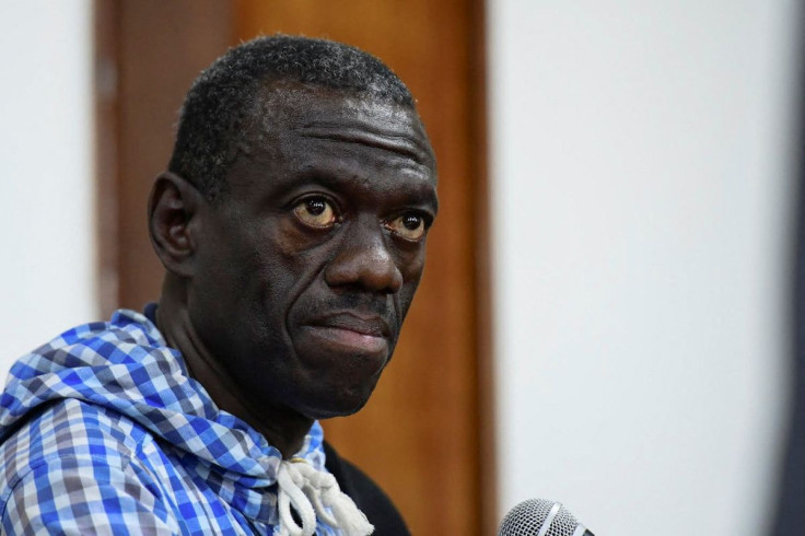 Veteran Ugandan opposition leader Kizza Besigye sits in the dock at the courtroom where he was charged with inciting violence during a protest against soaring consumer prices, in Kampala, Uganda May 25, 2022.