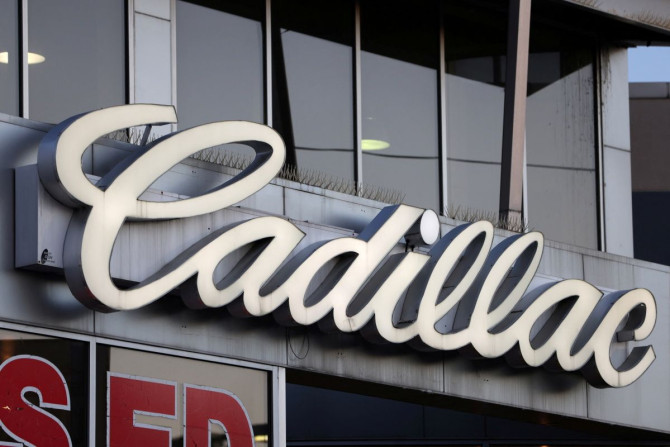 Signage for Cadillac, an automobile brand owned by General Motors Company, is seen at a car dealership in Queens, New York, U.S., November 16, 2021. 