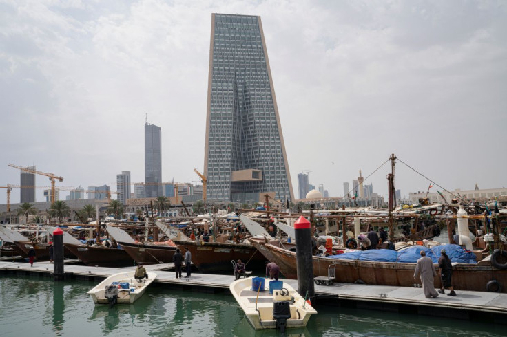 The Kuwait Central Bank towers are pictured over the traditional Dhow harbor as business deals and institutional lending for Gulf have frozen, following an outbreak of coronavirus disease (COVID-19), in Kuwait City, Kuwait March 18, 2020.