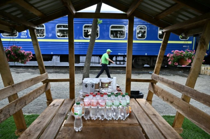 A dining car offers residents meals prepared every day by an NGO
