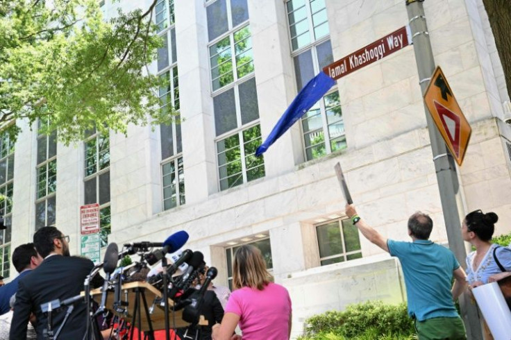 A street sign for Jamal Khashoggi Way is unveiled during outside the embassy of Saudi Arabia in Washington