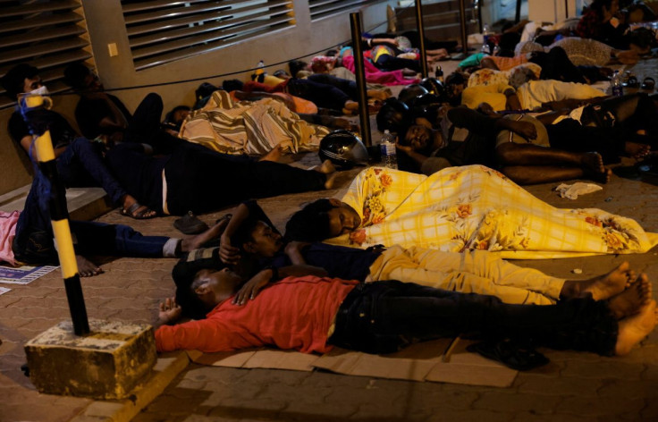 People sleep outside the Sri Lanka's Immigration and Emigration Department amid the country's economic crisis, in Colombo, Sri Lanka, June 9, 2022. Picture taken June 9,2022.